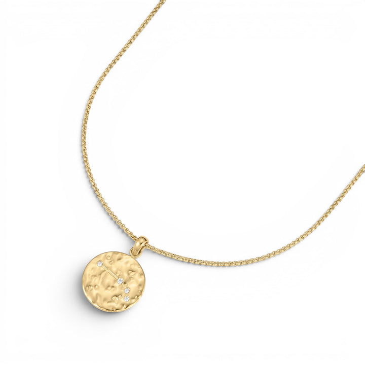 DLouise gold Aries zodiac talisman necklace with hammered finish and small diamonds.