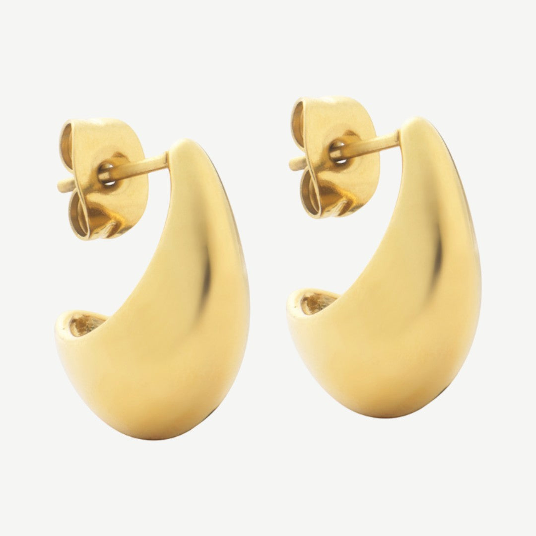 Niche Jewellery D. Louise mini gold hoop earrings with a sleek, curved, modern design. Waterproof and tarnish-free.