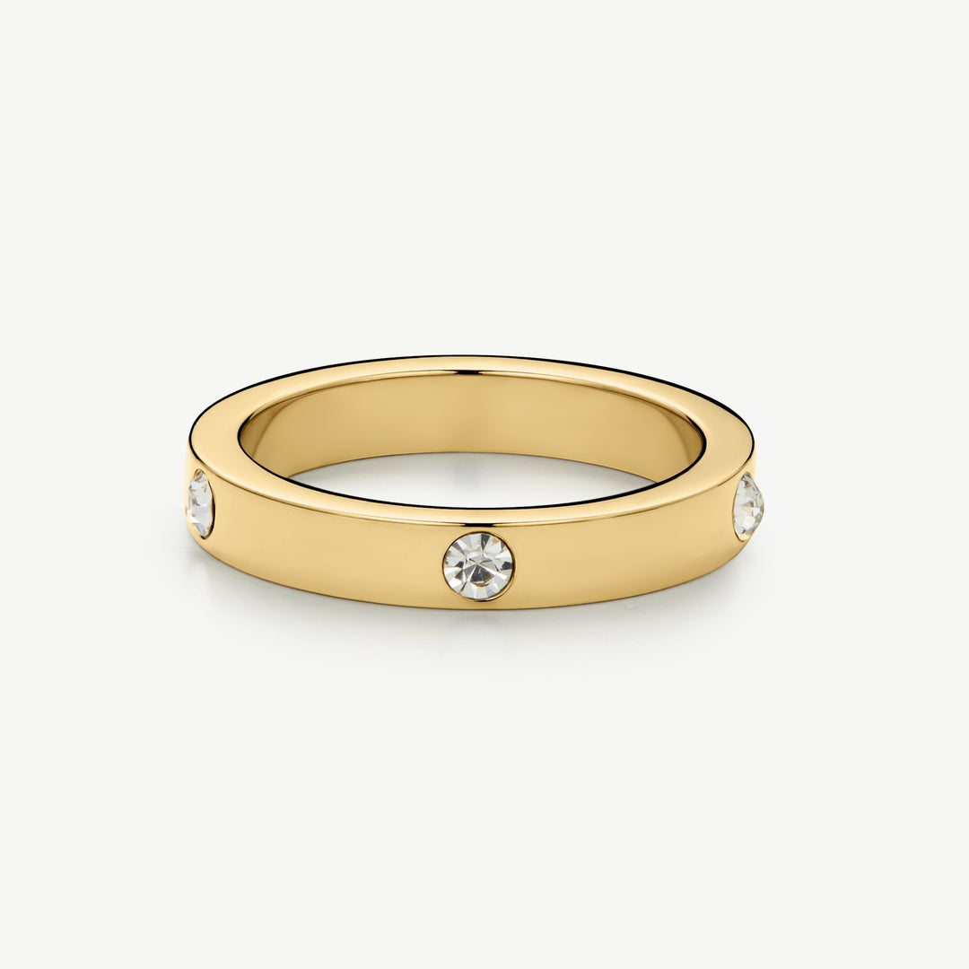 Niche Jewellery gold eternity stacking ring with clear crystals, made of stainless steel.