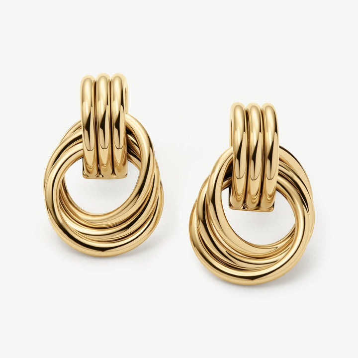 Niche Jewellery gold knot statement stud earrings with a contemporary twist design, water-safe and tarnish-resistant.