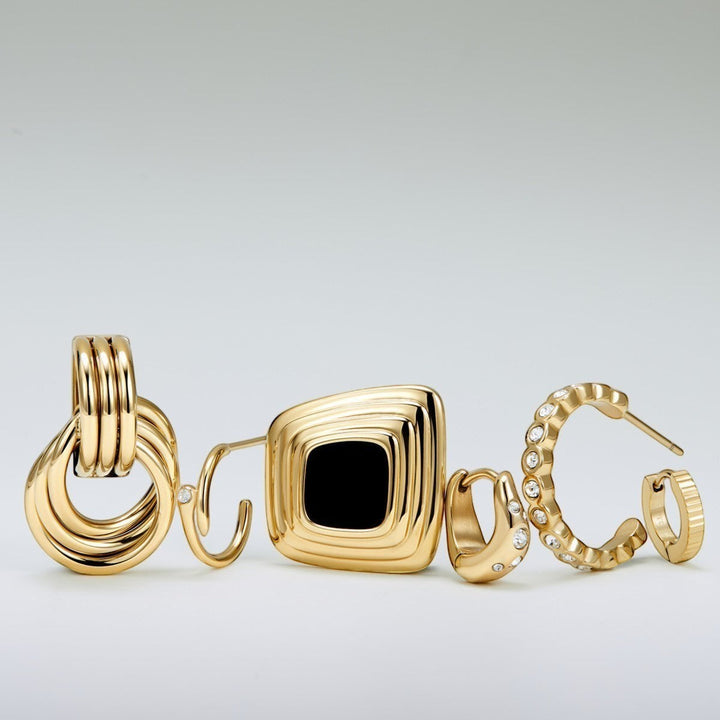 Niche Jewellery gold knot statement earrings with contemporary twist design, water-safe and tarnish-resistant.
