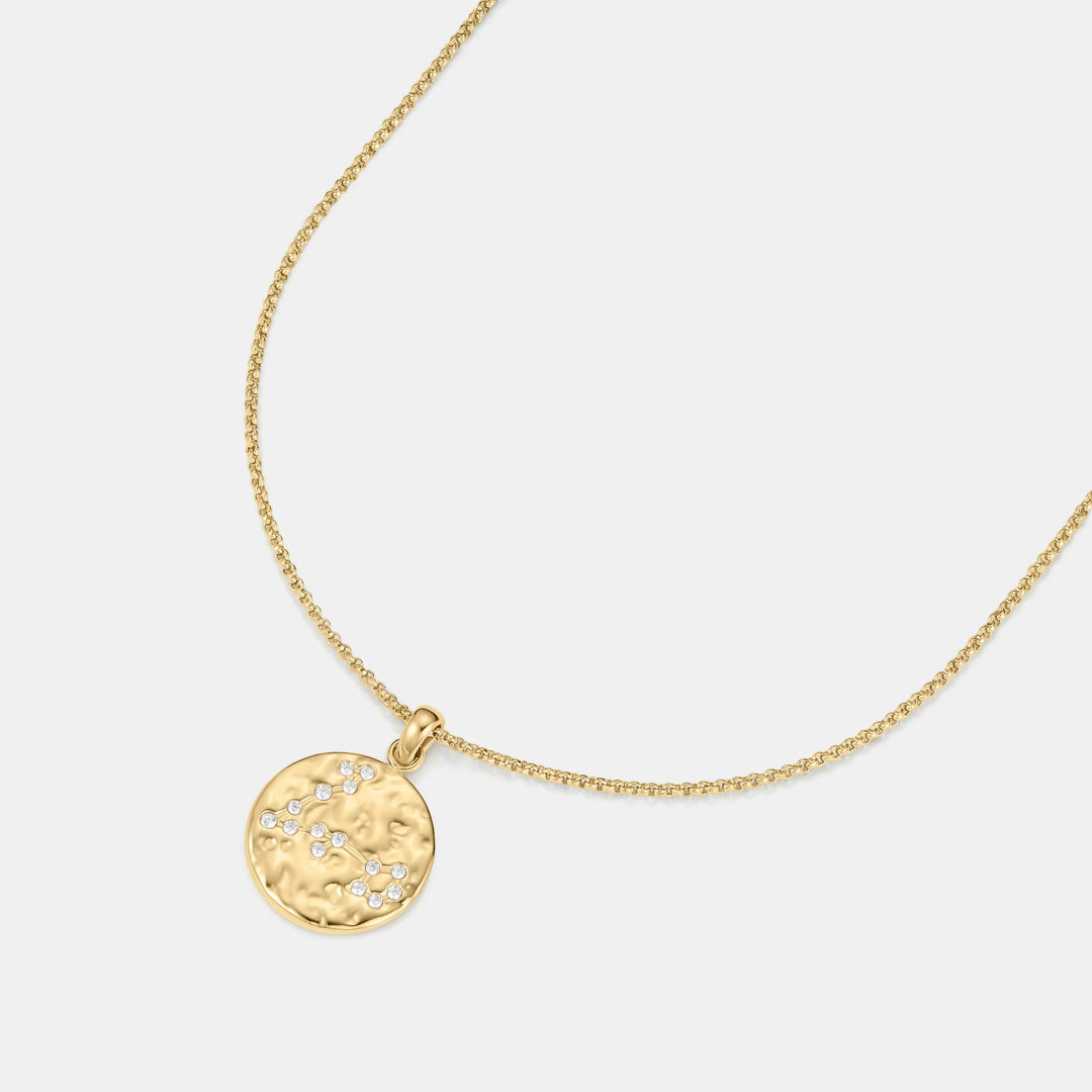Niche Jewellery gold Pisces zodiac talisman necklace with hammered finish and small diamonds.