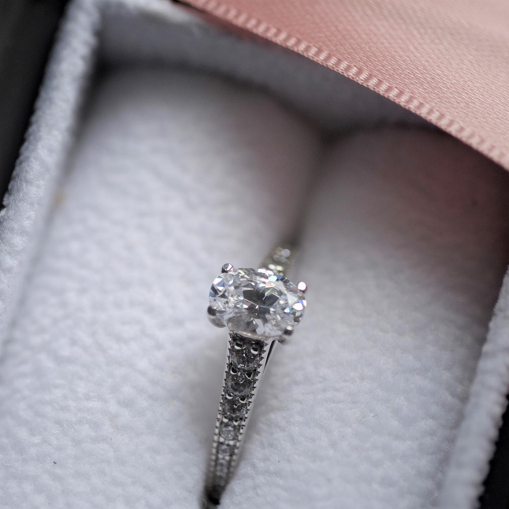 Oval Cut Diamond Solitaire Ring with Vintage Style Shoulders