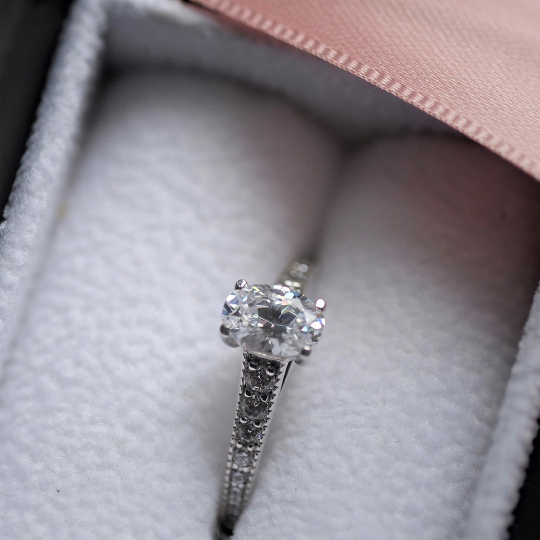 Oval Cut Diamond Solitaire Ring with Vintage Style Shoulders