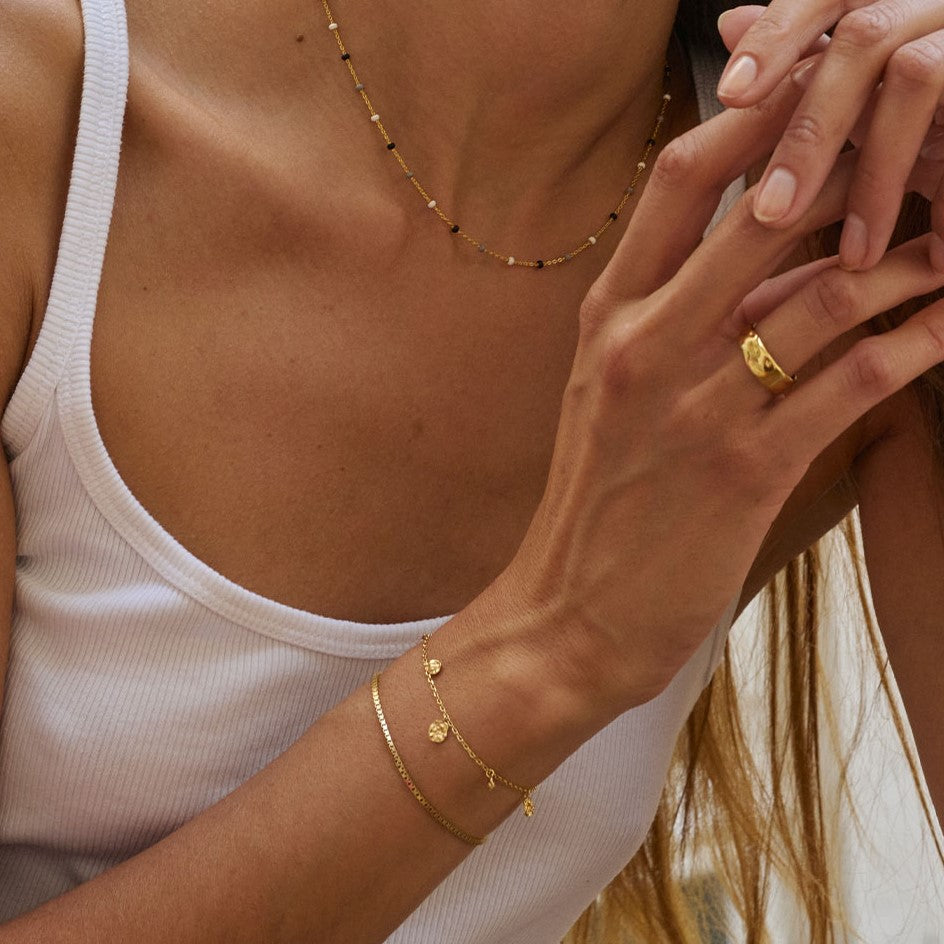 Enamel Copenhagen Refined Charms Gold Bracelet. Item code B133GM.
