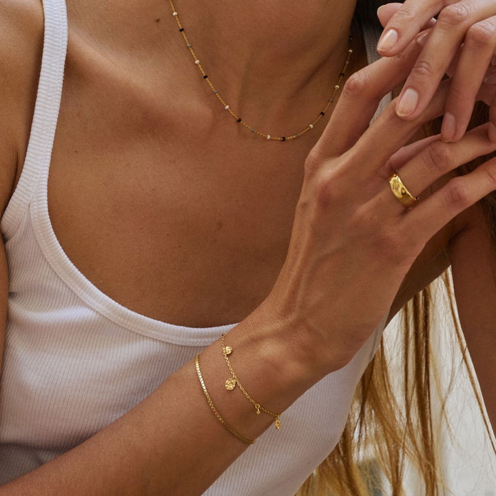 Enamel Copenhagen Refined Charms Gold Bracelet. Item code B133GM.