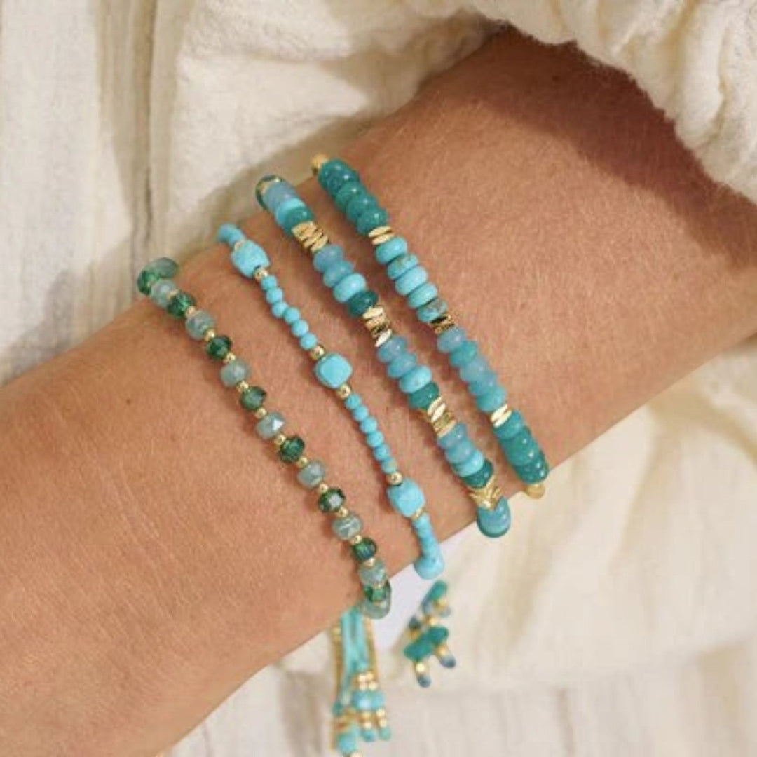 Boho Betty Serena adjustable bracelet with turquoise howlite, jade gemstones and gold-plated accents.